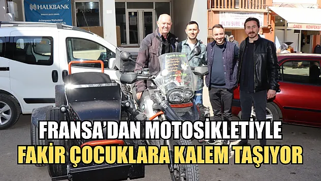 Fransa'dan motosikletiyle fakir çocuklara kalem taşıyor
