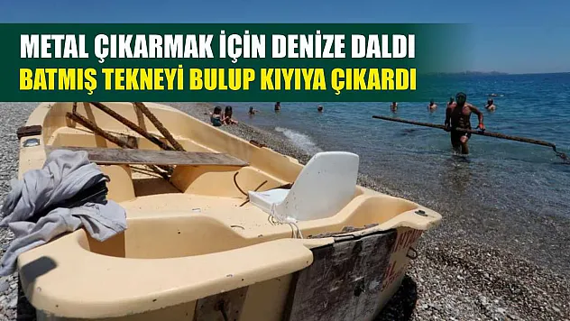 Metal çıkarmak için denize daldı, batmış tekneyi bulup kıyıya çıkardı