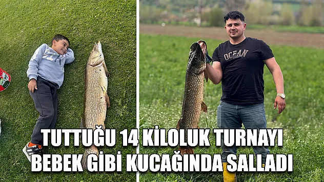 Tuttuğu 14 kiloluk turnayı bebek gibi kucağında salladı