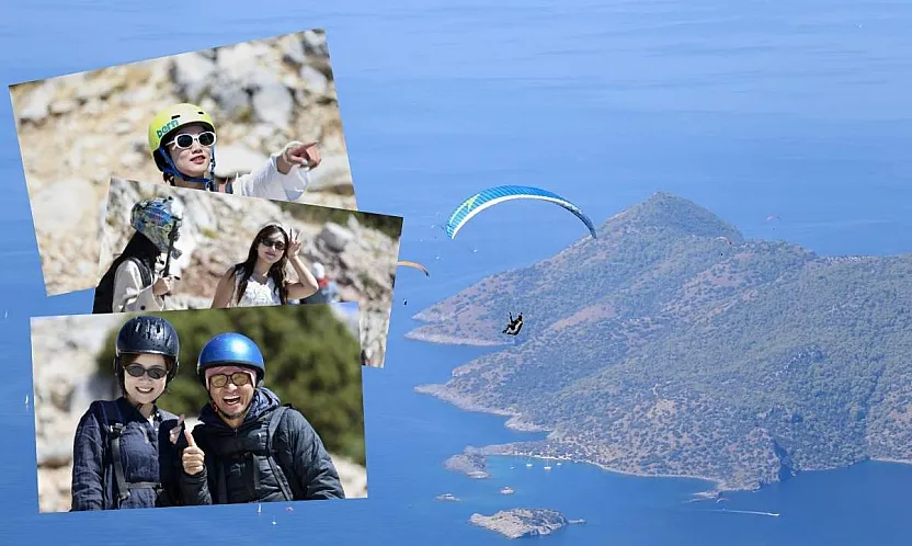 Fethiye'de yamaç paraşütü uçuşlarında Çinli tursit yoğunluğu yaşanıyor